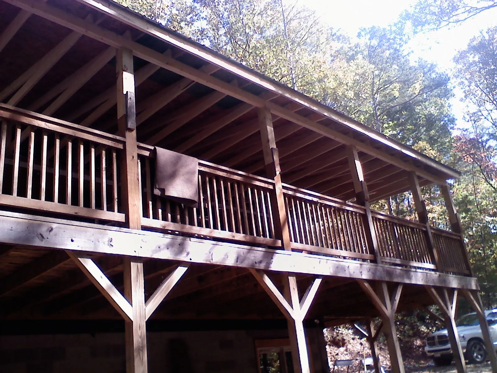 Timber framing under a new elevated porch and deck — Roof Leak Repair in Benzonia by Roofing Brothers